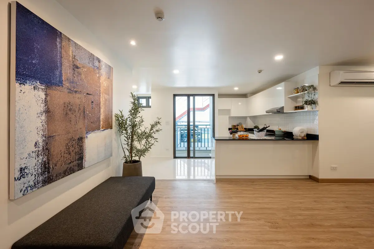 Spacious modern living room with open kitchen and stylish decor
