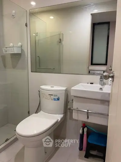 Modern bathroom with glass shower and sleek fixtures