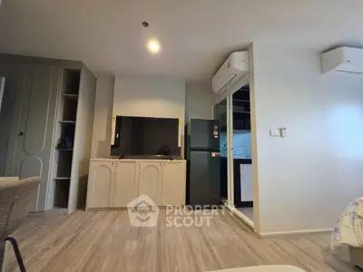 Modern living room with sleek furniture and open kitchen layout