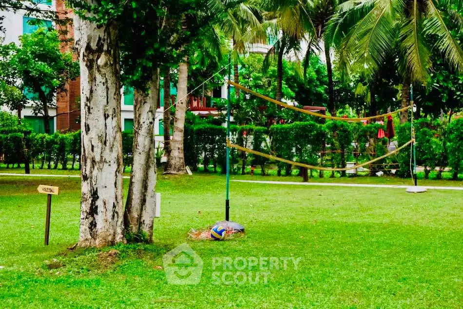 Lush green garden with volleyball net in a residential complex