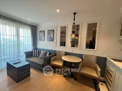 Charming living room with elegant decor and natural light, featuring cozy seating and stylish lighting.