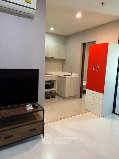 Modern apartment interior with compact kitchen and stylish living area