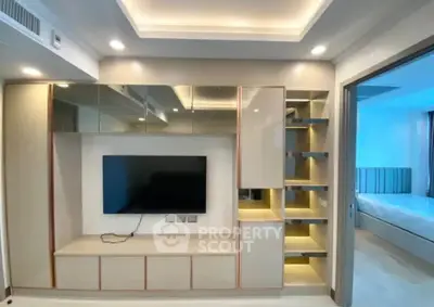 Modern living room with built-in TV unit and ambient lighting
