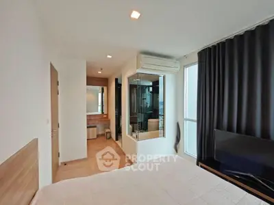 Modern bedroom with ensuite bathroom and large window