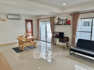Spacious modern living room with dining area and natural light