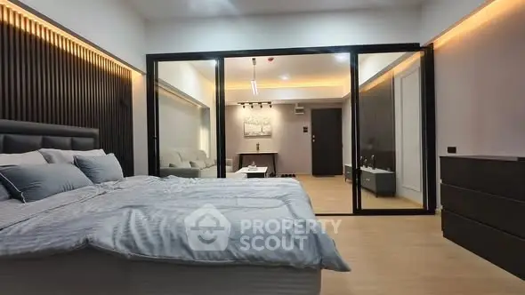 Modern bedroom with glass partition and stylish decor