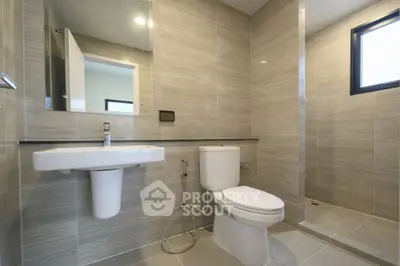 Modern bathroom with sleek tiles and contemporary fixtures
