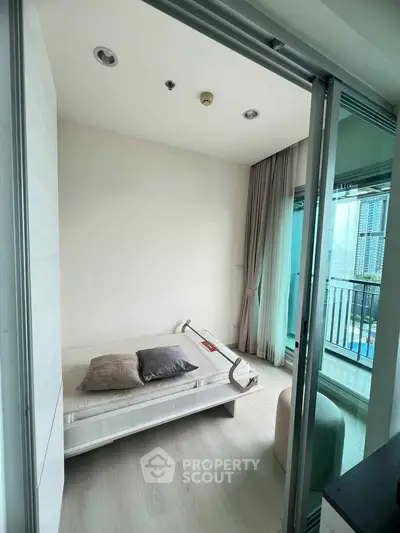 Modern bedroom with balcony view in urban apartment