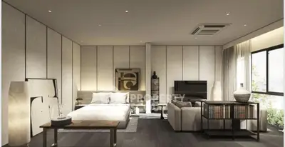Luxurious modern bedroom with elegant decor and large windows offering natural light.