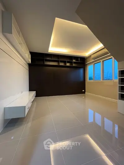 Modern living room with sleek design and built-in shelving