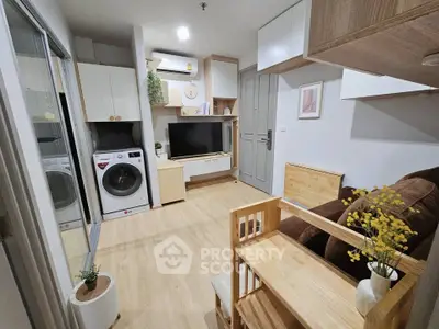 Modern living room with washing machine, TV, and stylish wooden furniture in cozy apartment.