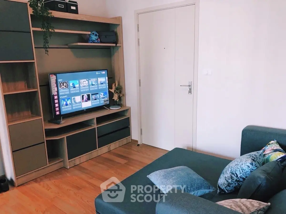 Cozy living room with modern entertainment center and stylish decor