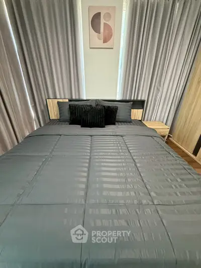 Cozy bedroom with modern decor and elegant curtains