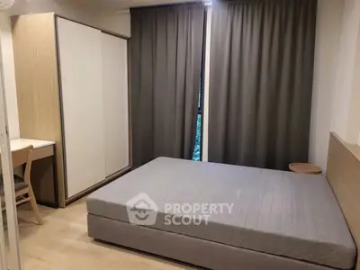 Modern bedroom with sleek design and ample natural light