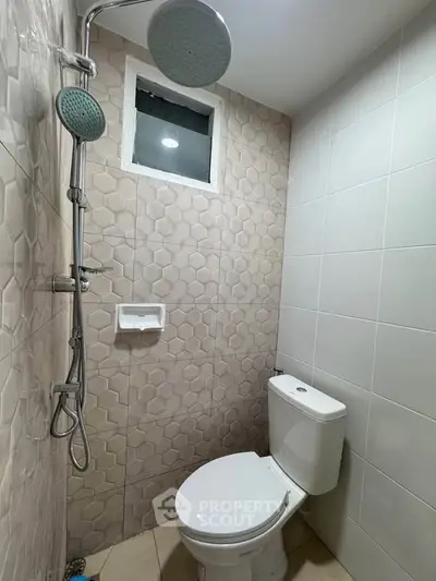 Modern bathroom with stylish shower and elegant tile design