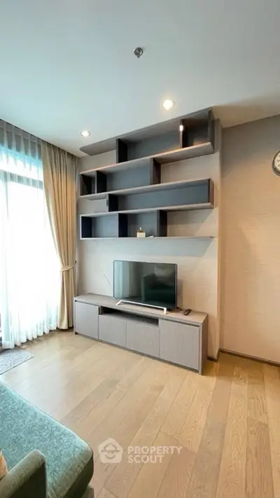 Modern living room with stylish shelving and natural light