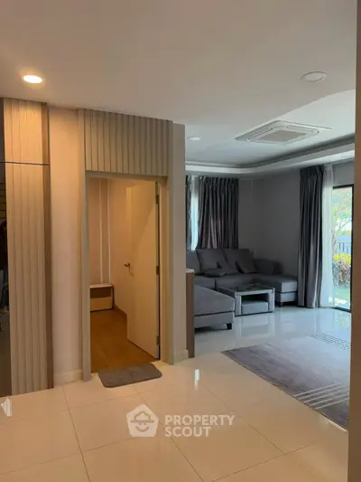 Spacious modern living room with elegant decor and natural light