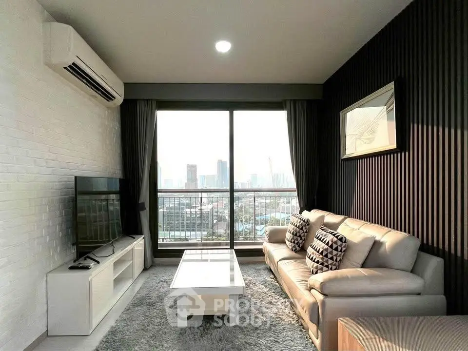 Modern living room with city view, featuring sleek furniture and large windows.
