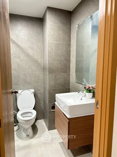 Modern bathroom with sleek design and elegant fixtures in a contemporary apartment.