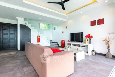 Spacious modern living room with stylish decor and entertainment setup