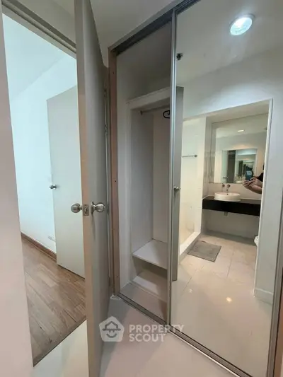 Modern bathroom with glass shower and sleek fixtures