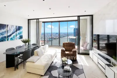 Luxurious living room with stunning city view, modern furniture, and elegant decor in high-rise apartment.