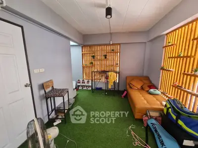 Cozy living room with artificial grass carpet and modern decor