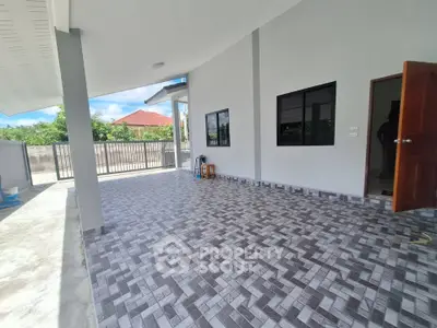 Spacious modern patio with tiled flooring and open-air design