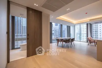 Luxurious open-plan living room with city view and modern dining area