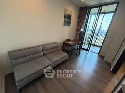 Modern living room with balcony view in high-rise apartment