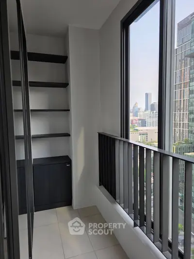 Modern balcony with city view and sleek shelving in urban apartment