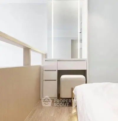 Modern bedroom with sleek vanity and minimalist design