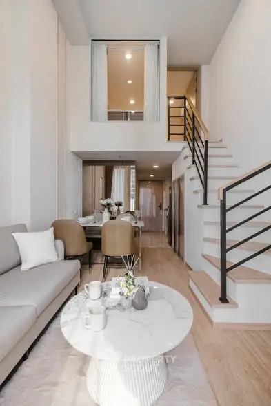 Modern duplex living room with stylish decor and open layout