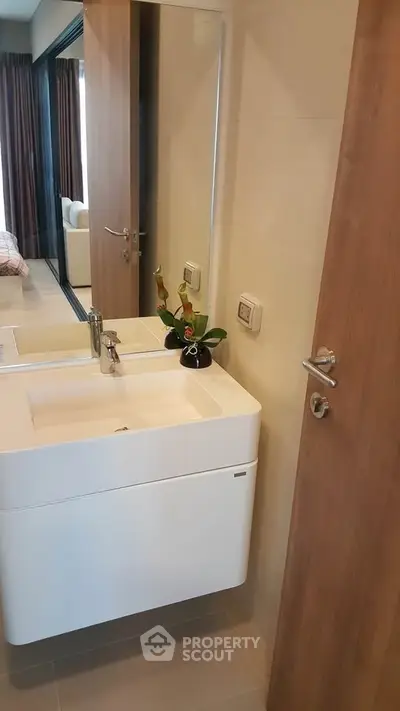 Modern bathroom with sleek white sink and stylish decor