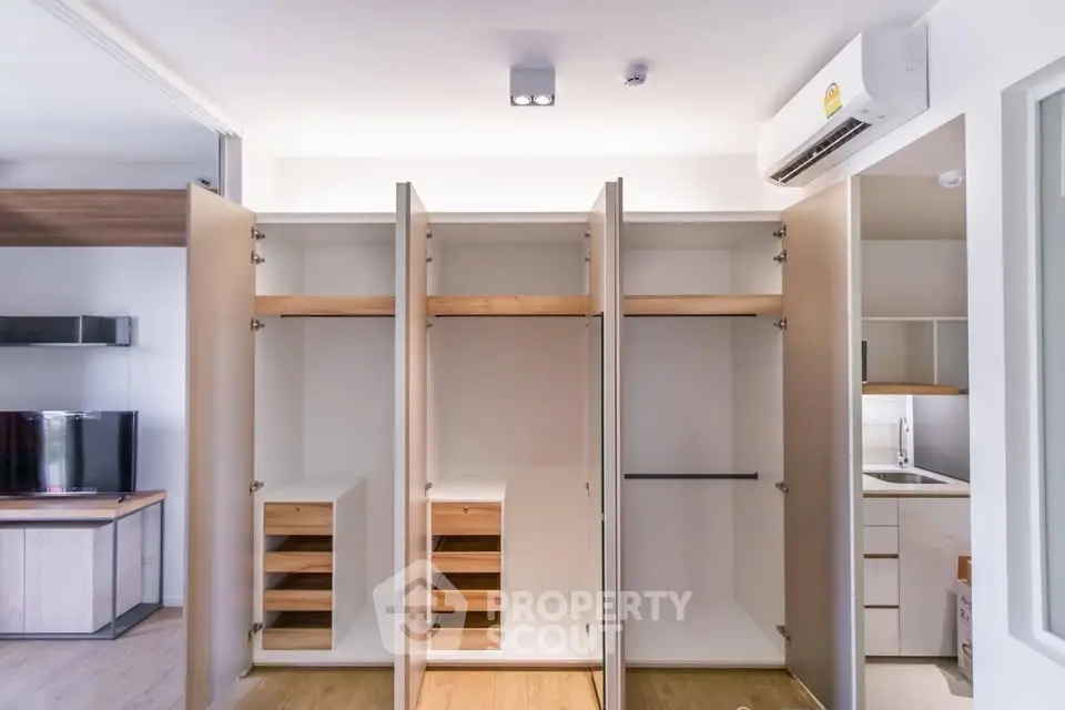 Spacious modern closet with open doors in a stylish apartment interior