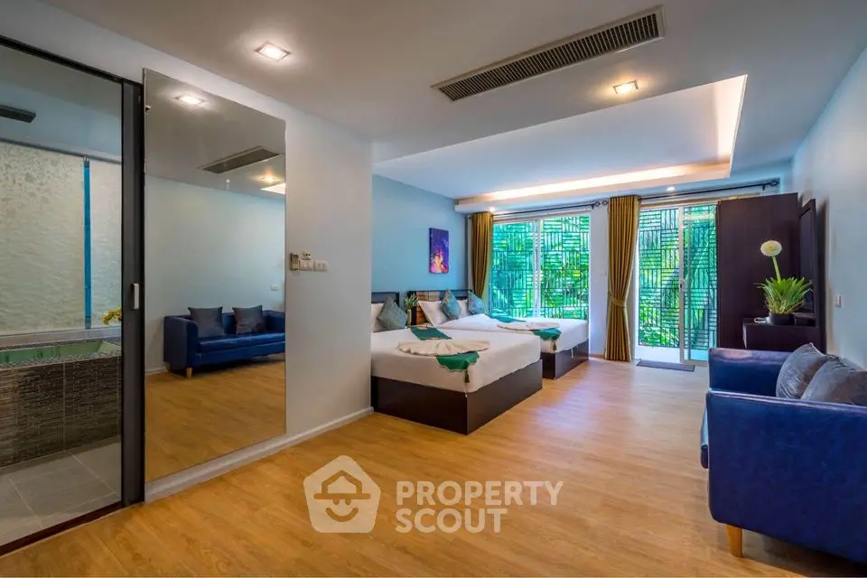 Spacious modern bedroom with large windows and stylish decor