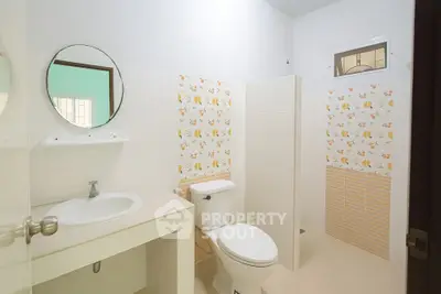 Bright and clean bathroom with modern fixtures and stylish tile accents.