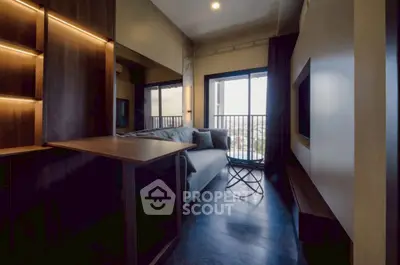 Stylish modern living room with balcony view and cozy seating area.