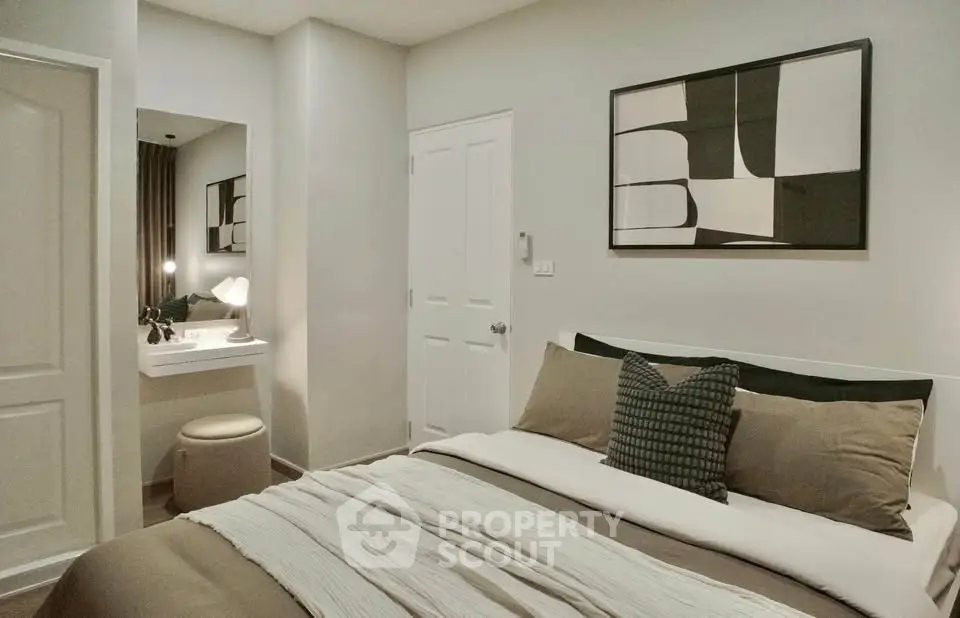 Cozy modern bedroom with stylish decor and neutral tones, perfect for relaxation and comfort.
