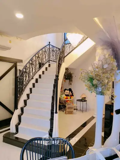 Elegant staircase with decorative railing in luxurious home interior