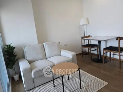 Cozy living room with modern furniture and natural light, perfect for relaxation.