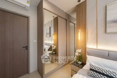 Modern bedroom with mirrored closet and elegant decor