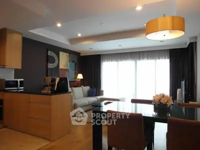 Modern open-plan living room with elegant dining area and stylish kitchen.