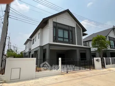 Modern two-story house with sleek design and spacious driveway