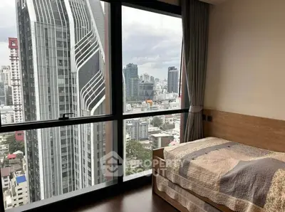 Modern bedroom with stunning city view in high-rise building