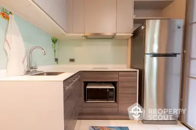 Modern kitchen with sleek cabinetry and stainless steel appliances