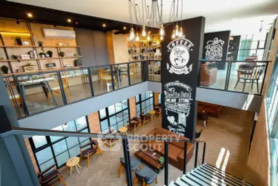 Modern cafe interior with stylish decor and mezzanine seating area