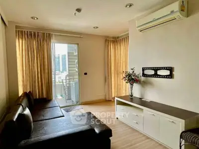 Spacious living room with balcony view in modern apartment