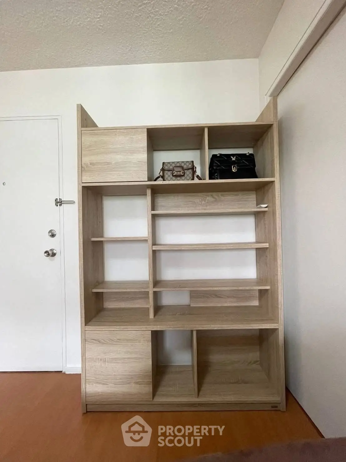 Modern wooden shelving unit in a stylish interior space, perfect for storage and display.