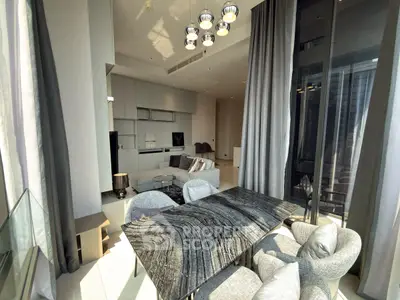 Luxurious modern living room with high ceilings and elegant decor